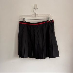 Tail tech black pleated tennis skirt with adorable red ribbon accent. Size 12